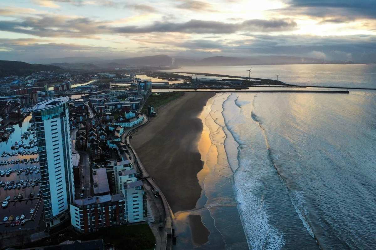 A sunset view of the Swansea coastline.